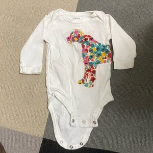 Carters brand dog onesie with floral print inside dog outline. Size 3mo